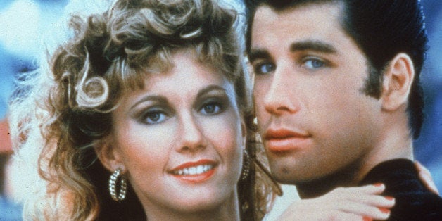 Actors John Travolta and Olivia Newton-John embrace in a promotional still for the film, 'Grease,' directed by Randal Kleiser
