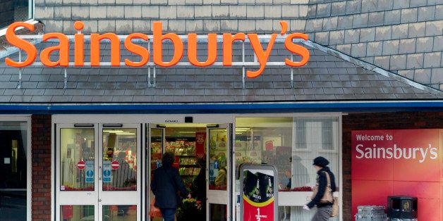 People enter a Sainsbury's store in West Wickham, south London, Wednesday, Nov. 11, 2009. Sainbury's the UK's third biggest grocery chain posted underlying profits of 307 million pounds (US$ 511.3 million euro342.4 million) an 18.5% rise in profits for the first six months of the year. (AP Photo/Sang Tan)