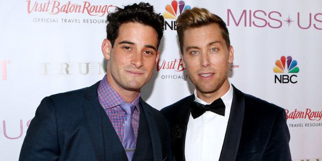Lance Bass, right, and Michael Turchin pose during a red carpet event before the Miss USA 2014 pageant in Baton Rouge, La., Sunday, June 8, 2014. (AP Photo/Jonathan Bachman)