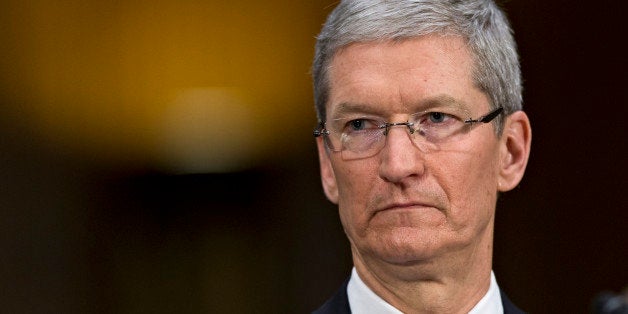 Apple CEO Tim Cook testifies on Capitol Hill in Washington, Tuesday, May 21, 2013, before the Senate Homeland Security and Governmental Affairs Permanent on Investigations as the panel examine the methods employed by multinational corporations to shift profits offshore and how such activities are affected by the Internal Revenue Code. Lawmakers want to know the tax strategy of how Apple, the world's most valuable company, based in Cupertino, Calif., holds a billion dollars in an Irish subsidiary as a tax strategy, according to a report issued this week by the subcommittee. (AP Photo/J. Scott Applewhite)