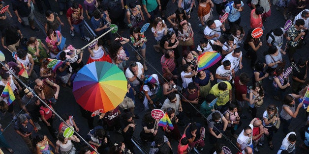 ISTANBUL, TURKEY - JUNE 29: People take part lesbian, gay, bisexual, and transgender (LGBT) Pride march on Istiklal Street in Beyoglu district of stanbul, Turkey on June 29, 2014. (Photo by Isa Terli/Anadolu Agency/Getty Images)