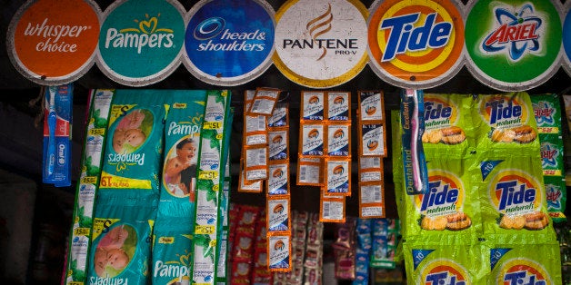 Packs of Procter & Gamble Co. Oral-B toothbrushes, from left, Head & Shoulders shampoo, Pampers diapers, Tide laundry detergent and Ariel laundry detergent are displayed in a store off a highway near Ganeshpur, in the state of Uttar Pradesh, India, on Wednesday, April 18, 2012. Winning over rural India is important to Unilever, Procter & Gamble Co. and Emami because about 69 percent of India's 1.2 billion people live in villages. Photographer: Prashanth Vishwanathan/Bloomberg via Getty Images 