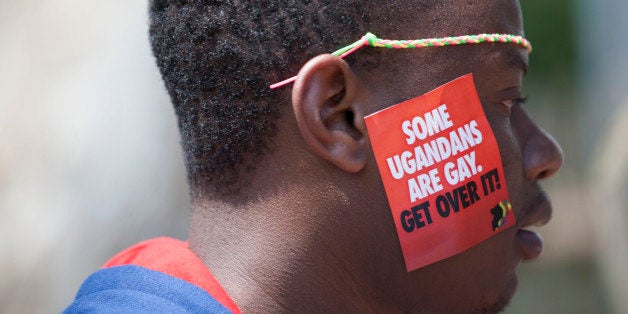 A Ugandan man is seen during the 3rd Annual Lesbian, Gay, Bisexual and Transgender (LGBT) Pride celebrations in Entebbe, Uganda, Saturday, Aug. 9, 2014. Scores of Ugandan homosexuals and their supporters are holding a gay pride parade on a beach in the lakeside town of Entebbe. The parade is their first public event since a Ugandan court invalidated an anti-gay law that was widely condemned by some Western governments and rights watchdogs. (AP Photo/Rebecca Vassie)