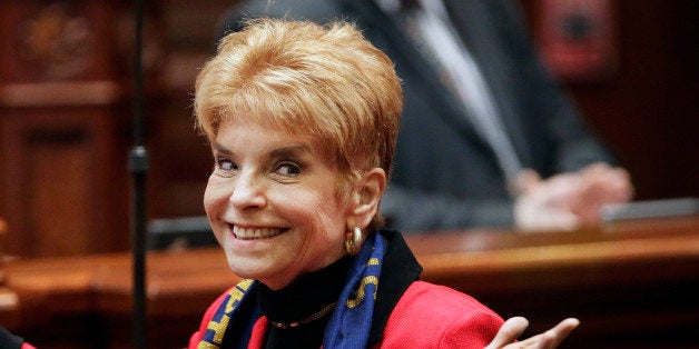 FILE - In this March 6, 2013 file photo, Illinois Comptroller Judy Baar Topinka gestures on the House floor at the state Capitol in Springfield, Ill. Topinka, who won a second term in November 2014, died early Wednesday morning, Dec. 10, 2014, less than 24 hours after having a stroke, according to her office. She was 70. Topinka previously served three terms as Illinois state treasurer, was a former Illinois GOP chairwoman and ran for governor in 2006. (AP Photo/Seth Perlman, File)