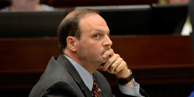 South Carolina Attorney General Alan Wilson listens during proceedings in the South Carolina Supreme Court Tuesday, June 24, 2014, in Columbia, S.C. Wilson is appealing a judge's ruling that a legislative panel must first sign off before he pursues charges against Speaker Bobby Harrell. (AP Photo/ Richard Shiro)