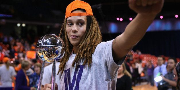 CHICAGO, IL - SEPTEMBER 12: Brittney Griner #42 of the Phoenix Mercury holds the championship trophy after a win over the Chicago Sky during game three of the WNBA Finals at the UIC Pavilion on September 12, 2014 in Chicago, Illinois. The Mercury defeated the Sky 87-82 to win the championship. NOTE TO USER: User expressly acknowledges and agrees that, by downloading and or using this photograph, User is consenting to the terms and conditions of the Getty Images License Agreement. (Photo by Jonathan Daniel/Getty Images). (Photo by Jonathan Daniel/Getty Images) 
