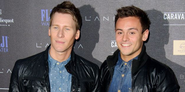 British athlete Tom Daley, left, and U.S screenwriter Dustin Lance Black arrive for the Battersea Power Station Annual Party at a central London venue, Wednesday, April. 30, 2014. (Photo by Jonathan Short/Invision/AP)