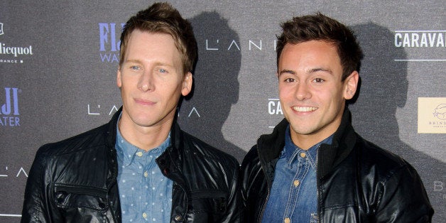 British athlete Tom Daley, left, and U.S screenwriter Dustin Lance Black arrive for the Battersea Power Station Annual Party