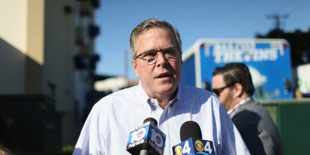 MIAMI, FL - DECEMBER 17: Former Florida Governor Jeb Bush speaks to the media as he hands out items for Holiday Food Baskets to those in need outside the Little Havana offices of CAMACOL, the Latin American Chamber of Commerce on December 17, 2014 in Miami, Florida. Mr. Bush spoke to the media, as he handed out food, about the annoucement that the United States and Cuba worked out a deal for the release of USAID subcontractor Alan Gross. (Photo by Joe Raedle/Getty Images)