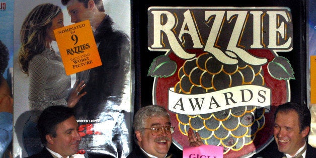 John Wilson, center, announces with Glenn Simon, left, and Bill Jones, right, the 24th Annual Golden Raspberry Award for 2003