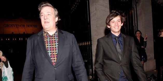 LONDON, UNITED KINGDOM - MARCH 30: Stephen Fry and Elliott Spencer are seen leaving the Grosvenor hotel, Park Lane on March 30, 2014 in London, England. (Photo by Niki Nikolova/FilmMagic)