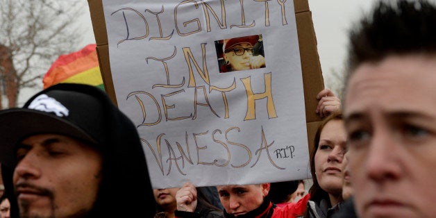 LAKEWOOD, CO. - JANUARY 13: Lorraine Helding holds a sign during a protest outside in Lakewood, CO January 13, 2015. A Lakewood minister refused to hold a memorial service on Saturday for Vanessa Collier, a mother of two at New Hope Ministries because the woman was gay, family and friends said Tuesday. (Photo By Craig F. Walker / The Denver Post)