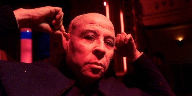 In this May 31, 2001 photo, Chilean writer Pedro Lemebel poses for a portrait before a presentation at a local theater in San