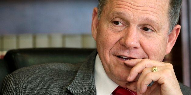 FILE -- In this Oct. 24, 2012 file photo, former Chief Justice Roy Moore poses for a photo in his Montgomery, Ala., office. Alabama's chief justice is trying to start a national movement to add an amendment to the U.S. Constitution defining marriage as the union of one man and one woman. In an interview with The Associated Press, Chief Justice Roy Moore said some judges have found new rights for gay unions that didn't exist before and the only way to stop them is with a state-initiated constitutional amendment. (AP Photo/Dave Martin)