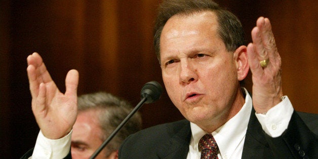 WASHINGTON - JUNE 8: Roy Moore, former Chief Justice of The Alabama Supreme Court, testifies at a Senate Constitution, Civil Rights and Property Rights Subcommittee hearing, entitled 'Beyond the Pledge of Allegiance: Hostility to Religious Expression in the Public Square.' on Capitol Hill in Washington, DC June 8, 2004. Moore was removed from office for refusing to take down a public display of the Ten Commandments in the courthouse. (Photo by Matthew Cavanaugh/Getty Images)