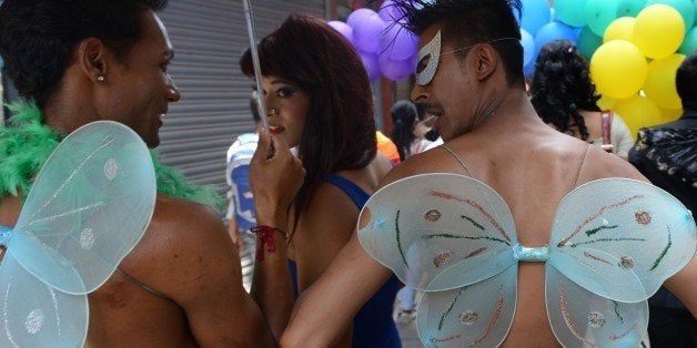 Participants march during Nepal's Gay Pride parade in Kathmandu on August 11, 2014. Scores of gays, lesbians, transvestites