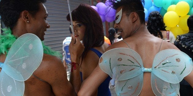 Participants march during Nepal's Gay Pride parade in Kathmandu on August 11, 2014. Scores of gays, lesbians, transvestites and transsexuals from across the country took part in the rally to spread their campaign for sexual rights in the country. AFP PHOTO/Prakash MATHEMA (Photo credit should read PRAKASH MATHEMA/AFP/Getty Images)