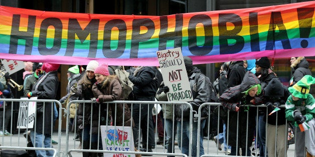 NEW YORK, NY - MARCH 17 : Thousands of people attend the 253rd annual St. Patrick's Day Parade along Fifth Avenue in New York City on March 17, 2014. Some members of LGBT (lesbian, gay, bisexual and transgender) protest against the exclusion of their community from the St. Patrick's Day Parade. Crowds appeared to be thinner in past years due to the cold weather. (Photo by Bilgin Sasmaz/Anadolu Agency/Getty Images)