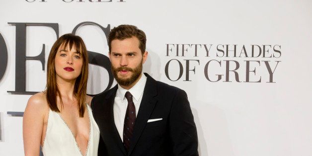 LONDON, UNITED KINGDOM - FEBRUARY 12: Dakota Johnson and Jamie Dornan attends the UK Premiere of 'Fifty Shades Of Grey' at Odeon Leicester Square on February 12, 2015 in London, England. (Photo by Julian Parker/UK Press via Getty Images)