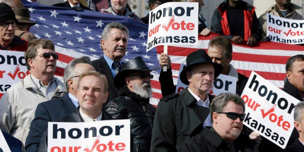 Supporters of a state law banning same sex marriage rally at the Arkansas state Capitol in Little Rock, Ark., Wednesday, Nov. 19, 2014. (AP Photo/Danny Johnston)