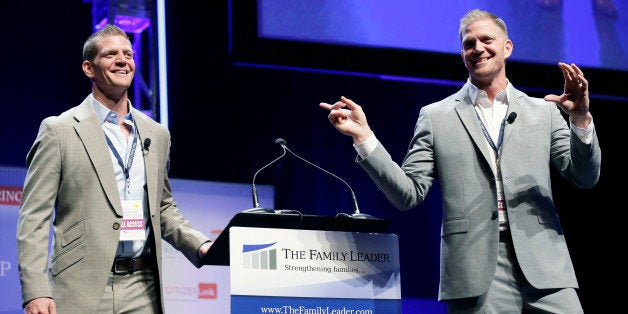 Jason Benham, right, and his twin brother David, left, speak during The Family Leadership Summit, Saturday, Aug. 9, 2014, in Ames, Iowa. The calendar says Iowa's presidential caucuses are more than a year away. But it's never too early for potential GOP presidential candidates in 2016 to court social conservatives in the early-voting state. (AP Photo/Charlie Neibergall)