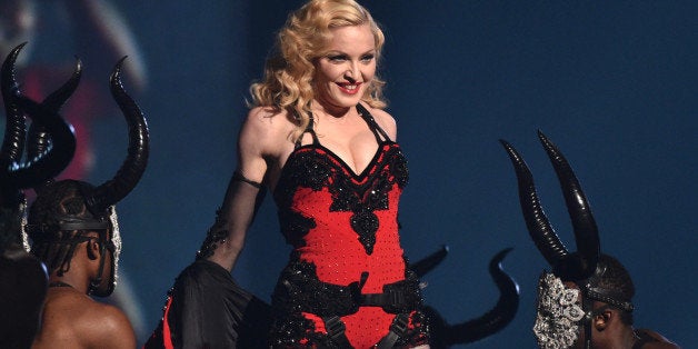 FILE - This Feb. 8, 2015 file photo shows Madonna performing at the 57th annual Grammy Awards in Los Angeles. Madonna, Rihanna and Sam Smith will perform at the second annual iHeartRadio Music Awards on March 29, 2015, at the Shrine Auditorium in Los Angeles, iHeartMedia announced Monday, March 9, 2015. (Photo by John Shearer/Invision/AP)