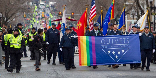 BOSTON - MARCH 15: Massachusetts Congressman Seth Moulton marches with OUTVETS, a non-profit that highlights the rights and contributions of LGBTQ veterans, active service members, and their families. Long snubbed gay rights groups finally marched in South Boston's famed St. Patrick's Day Parade on March 15, 2015. Because of this inclusion, Boston Mayor Marty Walsh and other politicians chose to march for the first time in support. (Photo by Dina Rudick/The Boston Globe via Getty Images)