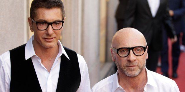 Fashion designers Stefano Gabbana, left, and Domenico Dolce arrive for the presentation of the book "Milan Fashion, soccer players portraits", in downtown Milan, Italy, Thursday, May 19, 2011. (AP Photo/Luca Bruno)