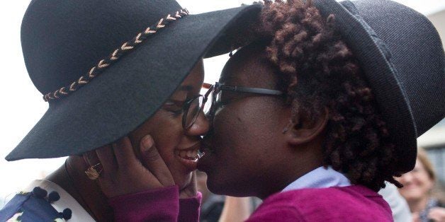 Tori Sisson, left, and ShantÃ© Wolfe, right, kiss after saying their marriage vows, Monday, Feb. 9, 2015, in Montgomery, Ala. Sisson and Wolfe were the first couple to file their marriage license. Alabama is the 37th state to allow gays and lesbians to wed. (AP Photo/Brynn Anderson)