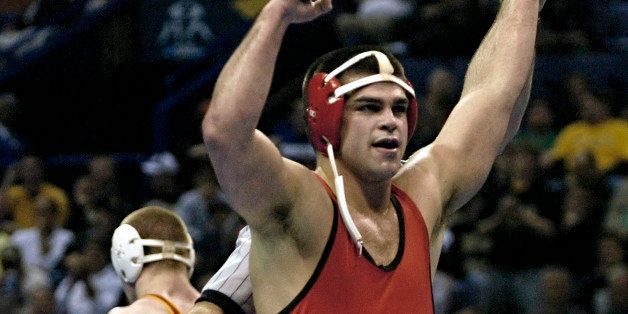 Ohio State's Mike Pucillo celebrates after defeating Iowa State's Jake Varner in a 184 pound championship match at the NCAA wrestling national championships Saturday, March 22, 2008 in St. Louis.(AP Photo/Tom Gannam)