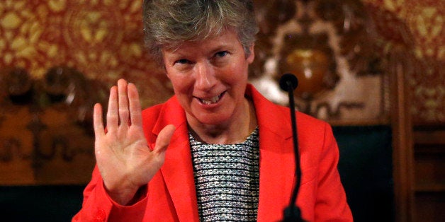Attorney Mary Bonauto acknowledges applause prior to speaking during a celebration held at Cambridge City Hall, Friday, May 1