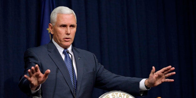 Indiana Gov. Mike Pence holds a news conference at the Statehouse in Indianapolis, Thursday, March 26, 2015. Pence has declared a public health emergency in response to the HIV epidemic in Scott County. Seventy two cases of HIV have been confirmed in the southern Indiana county. (AP Photo/Michael Conroy)