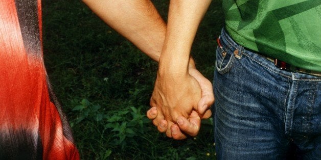 Two Young Men Holding Hands