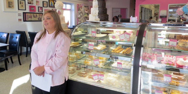 In this Jan. 20, 2015 photo, bakery owner Marjorie Silva stands for a photo inside her own Azucar Bakery, in Denver. Silva is facing a discrimination complaint with Coloradoâs Civil Rights Division because she refused to write hateful words about gays on a cake for a customer. (AP Photo/Ivan Moreno)