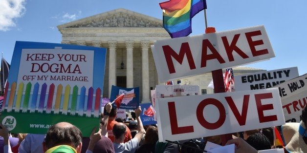 Supporters of same-sex marriages cheer outside the US Supreme Court on April 28, 2014 in Washington, DC. AFP PHOTO / MLADEN ANTONOV (Photo credit should read MLADEN ANTONOV/AFP/Getty Images)