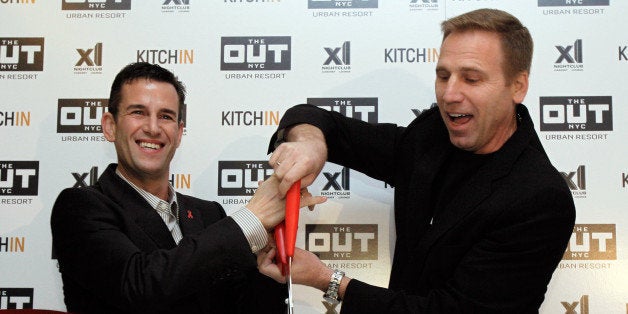 Ian Reisner, left, and Mati Weiderpass, co-owners of The Out NYC hotel, cut the ribbon for New York's new gay resort hotel, Thursday, March 1, 2012. The straight-friendly urban resort is located on 42nd Street, a few blocks from Times Square. (AP Photo/Richard Drew)