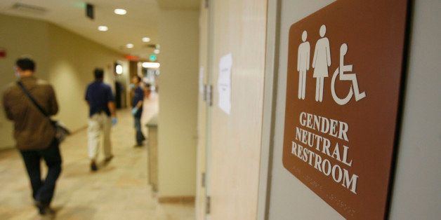 FILE- In this Aug. 23, 2007 file photo, a sign marks the entrance to a gender neutral restroom at the University of Vermont in Burlington, Vt. For opponents of transgender rights, a favorite line of attack is to oppose policies that would allow people to choose whether to use a men's or women's bathroom based on gender identity.(AP Photo/Toby Talbot, File)