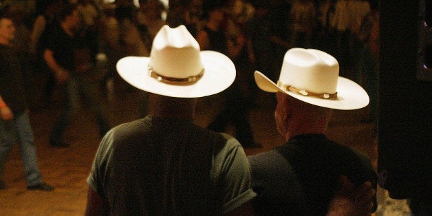 DEL MAR, CA - SEPTEMBER 17: Cowboys dance with one another on the eve of the gay-oriented 16th Annual San Diego Rodeo on September 17, 2004 in Del Mar, California. The San Diego Rodeo is put on by the Golden State Gay Rodeo Association (GSGRA), one of four founding associations of the International Gay Rodeo Association (IGRS). This is the 20th IGRA-sanctioned gay rodeo season in California. (Photo by David McNew/Getty Images)