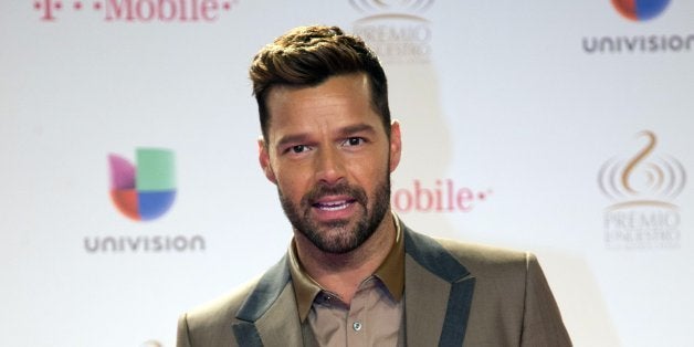 Puerto Rican singer Ricky Martin poses for photographers as he arrives at the Premio Lo Nuestro Latin Music Awards show, Thursday, Feb. 19, 2015, in Miami, Fla. (AP Photo/Wilfredo Lee)