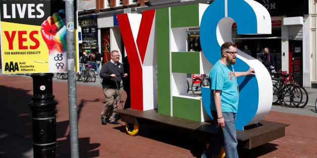 Members of the Yes Equality campaign begin canvassing in the center of Dublin, Ireland, Thursday May 21, 2015. People from across the Republic of Ireland will vote Friday in a referendum on the legalization of gay marriage, a vote that pits the power of the Catholic Church against the secular-minded Irish government of Enda Kenny. (AP Photo/Peter Morrison)