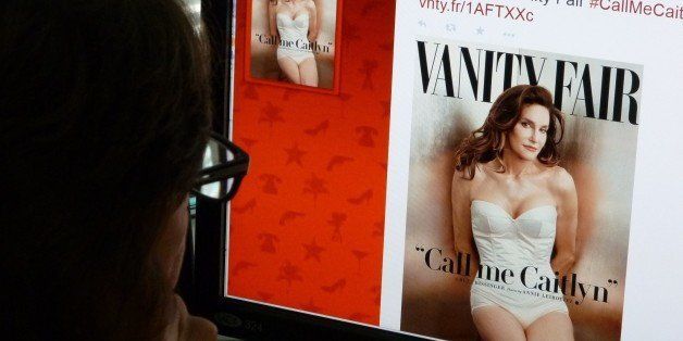 In this June 1, 2015 photo, a journalist looks at Vanity Fair's Twitter site with the Tweet about Caitlyn Jenner, who will be featured on the July cover of the magazine. Caitlyn Jenner, the transgender Olympic champion formerly known as Bruce, on Monday unveiled her new name and look in a sexy Vanity Fair cover shoot -- drawing widespread praise, including from the White House. Lesbian, gay, bisexual and transgender campaigners -- and many well-wishers -- welcomed the high-profile debut, as did the 65-year-old Jenner's family, which includes the media-savvy celebrity Kardashian clan. 'I'm so happy after such a long struggle to be living my true self,' Jenner wrote in her first tweet after the magazine released the July cover photo by renowned photographer Annie Leibovitz. AFP PHOTO / MLADEN ANTONOV (Photo credit should read MLADEN ANTONOV/AFP/Getty Images)