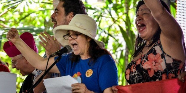 The daughter of Cuban President Raul Castro and director of the National Centre for Sexual Education (CENESEX) Mariela Castro (C), shouts slogans during a gay parade, on May 9, 2015, in Havana. AFP PHOTO/ADALBERTO ROQUE (Photo credit should read ADALBERTO ROQUE/AFP/Getty Images)