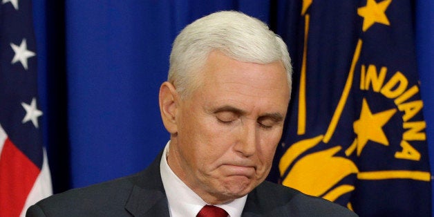 Indiana Gov. Mike Pence listens to a question during a news conference, Tuesday, March 31, 2015, in Indianapolis. Pence said that he wants legislation on his desk by the end of the week to clarify that a new religious-freedom law does not allow discrimination. The law has triggered an outcry, with businesses and organizations voicing concern and some states barring government-funded travel to the Midwestern state. (AP Photo/Darron Cummings)