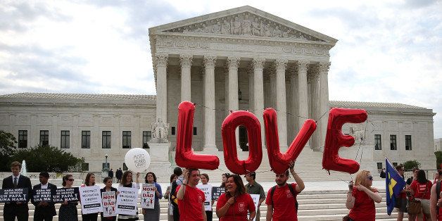 WASHINGTON, DC - JUNE 25: Supporters for and against gay marriage gather in front of the Supreme Court Building June 25, 2015 in Washington, DC. The high court is expected rule in the next few days on whether states can prohibit same sex marriage, as 13 states currently do. (Photo by Mark Wilson/Getty Images)