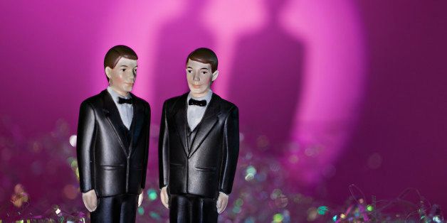 Two male figurines in formal attire illustrate same sex union. Pink and rainbow background with shadows adds drama but leaves ample copy space for a non threateaning way to illustrate the concept. Canon Eos 5D Mk 2. Discover more in