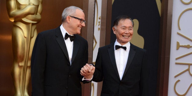 Brad Altman and George Takei arrive at the Oscars on Sunday, March 2, 2014, at the Dolby Theatre in Los Angeles. (Photo by Jordan Strauss/Invision/AP)