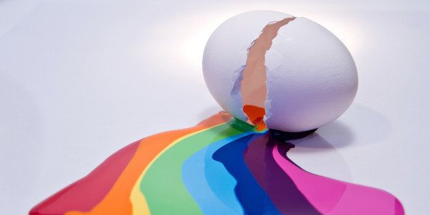 Cracked egg shell leaking a colorful, rainbow like liquid to simbolize creativity