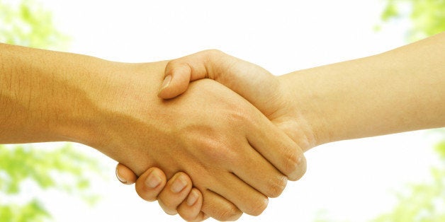 Close-up Of A Man And Woman Shaking Hand, Outdoors