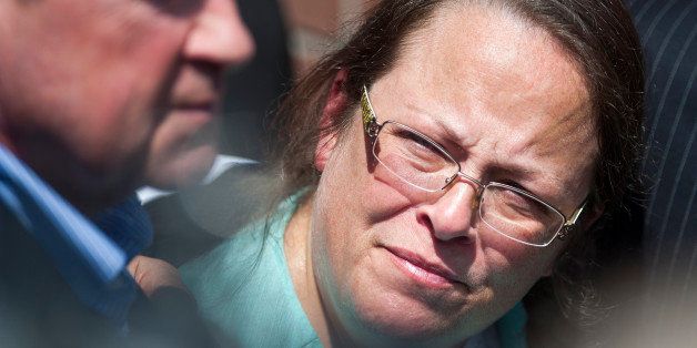 GRAYSON, KY - SEPTEMBER 8: Kim Davis, Clerk of Courts in Rowan County, Kentucky, looks over at Mike Huckabee after she was released from six days of incarceration at the Carter County Detention Center on September 8, 2015 in Grayson, Kentucky. Davis was ordered to jail last week for contempt of court after refusing a court order to issue marriage licenses to same-sex couples. (Photo by Ty Wright/Getty Images)