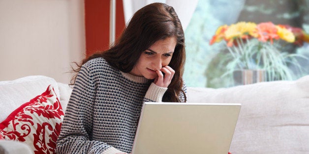 teenage girl looking worried due to internet bullying